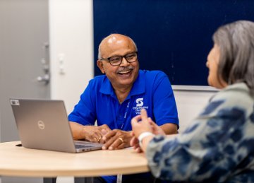 Volunteer planting a tree on City-managed grounds